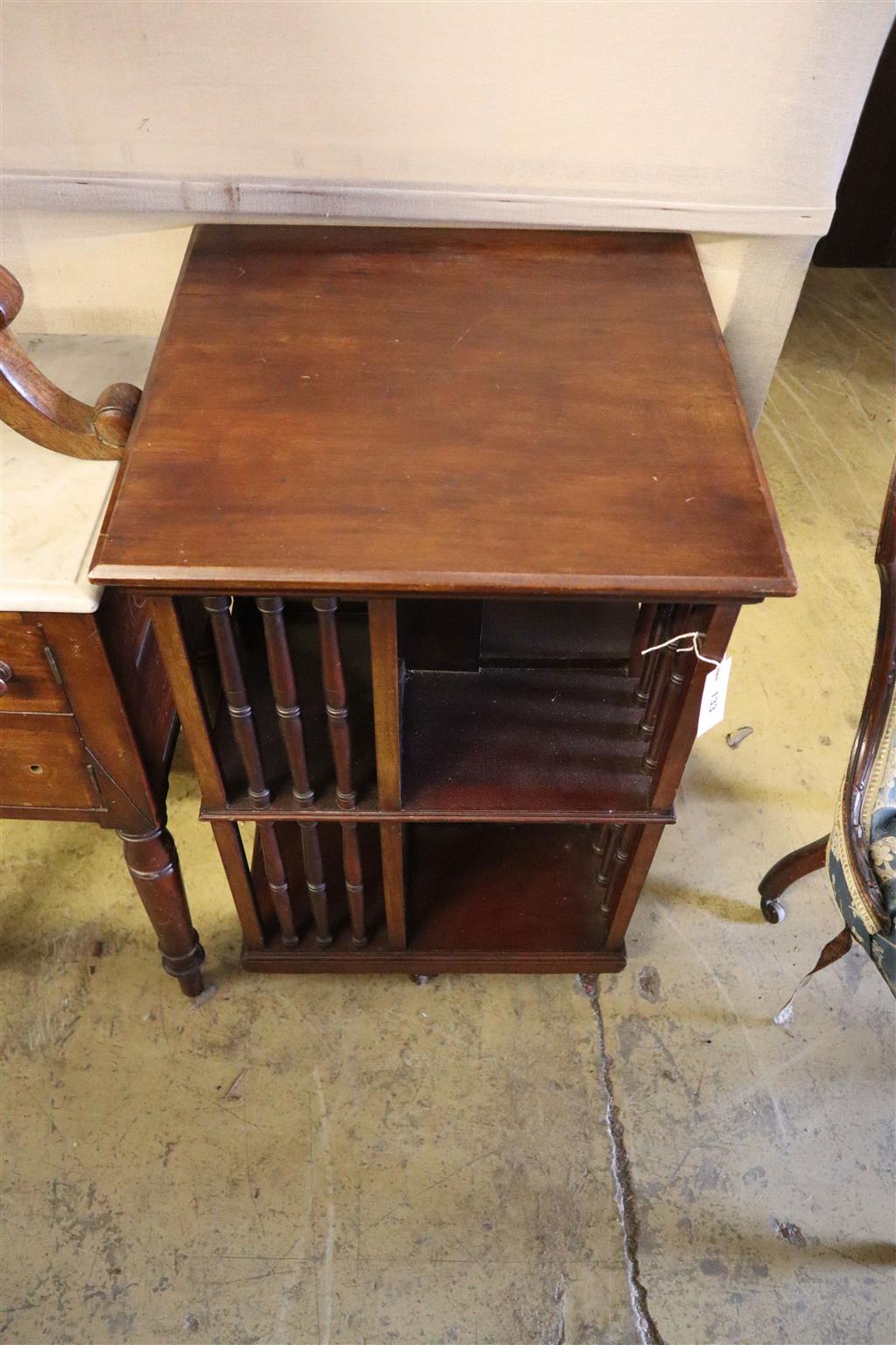 A late Victorian mahogany revolving bookcase, width 52cm, depth 52cm, height 84cm